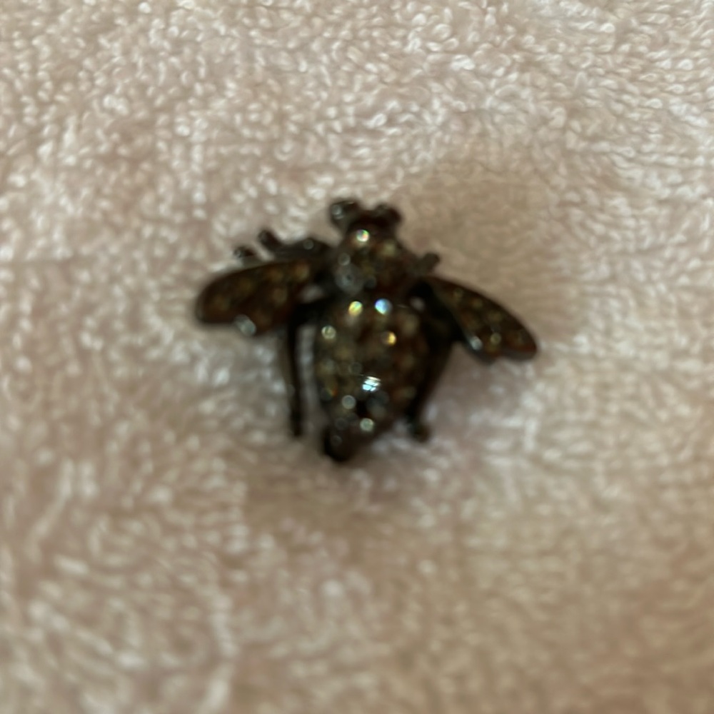 Joan Rivers, black bee pin  with rhinestones